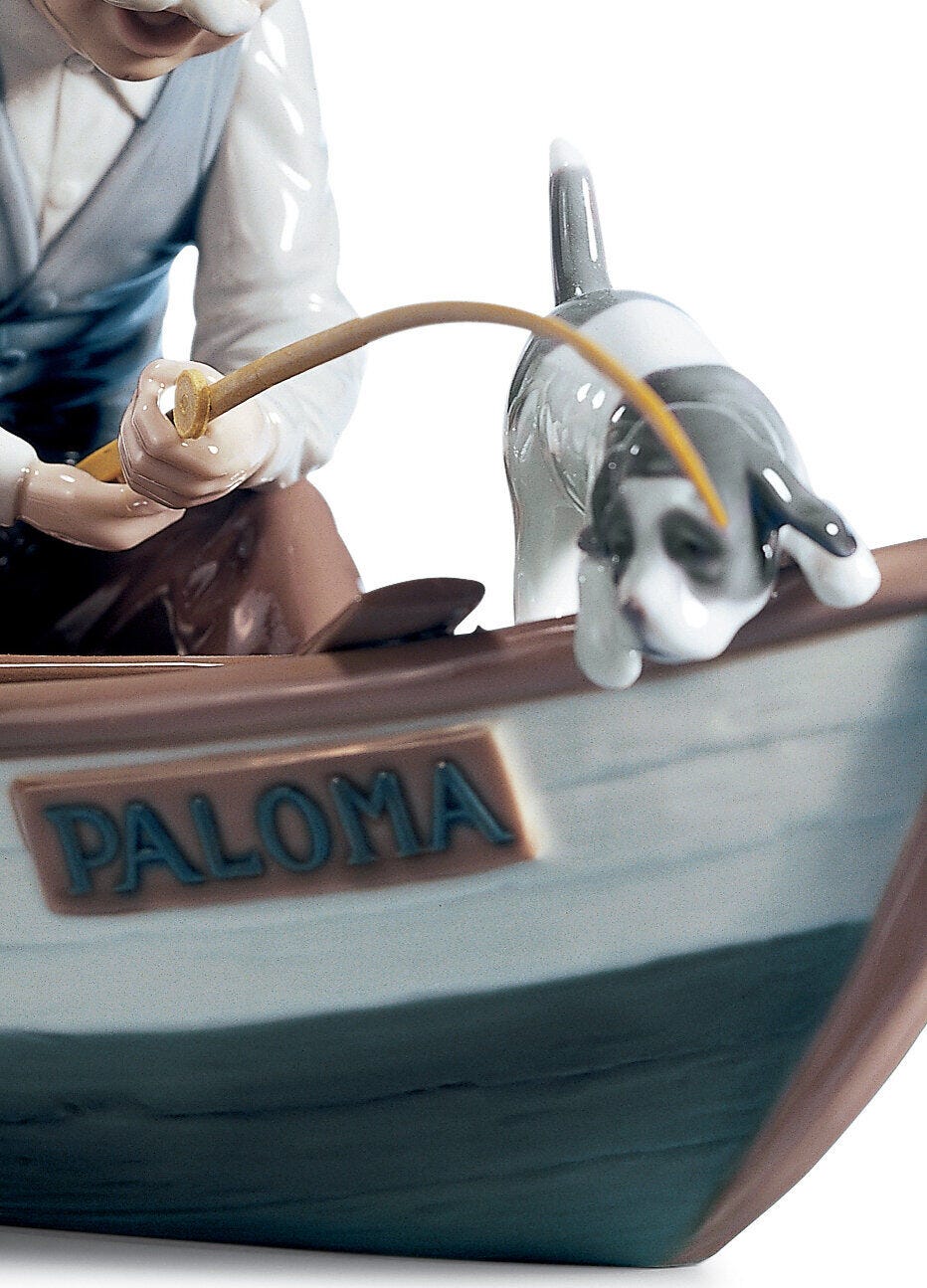 Bonhams : A Lladro figure group of man and boy fishing in a boat