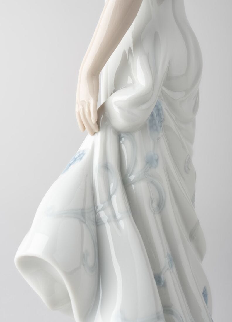 A Flower's Whisper Woman Figurine in Lladró